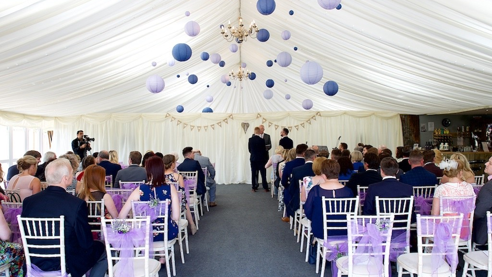 Purple lanterns decorate The Granary at Fawsley Hanging Lantern Company